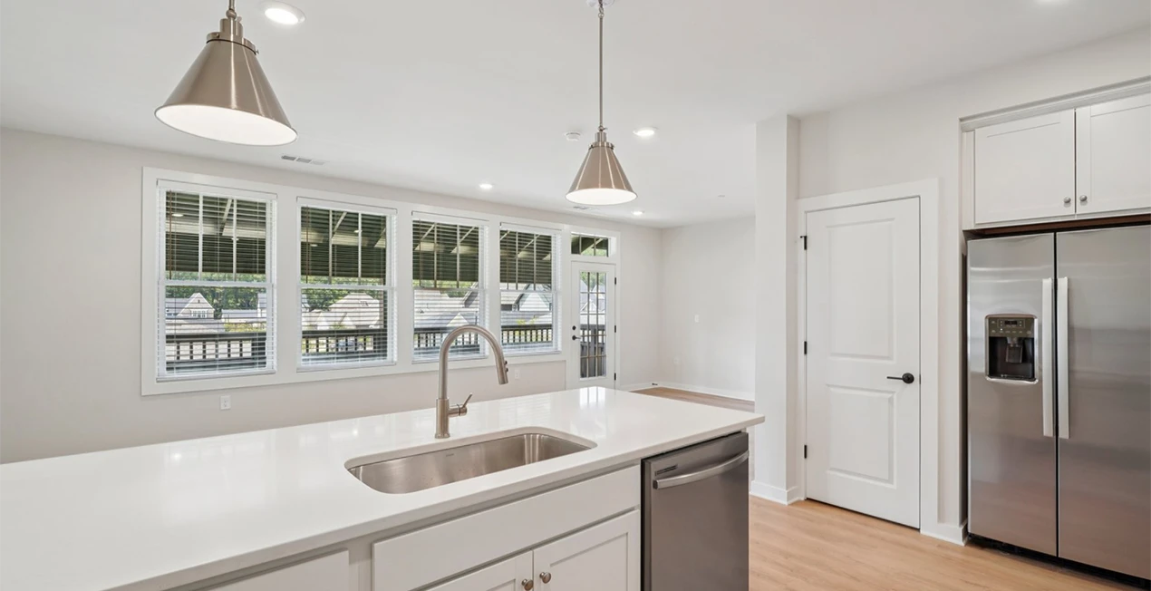 large open kitchen with island sink in arise knox square apartment